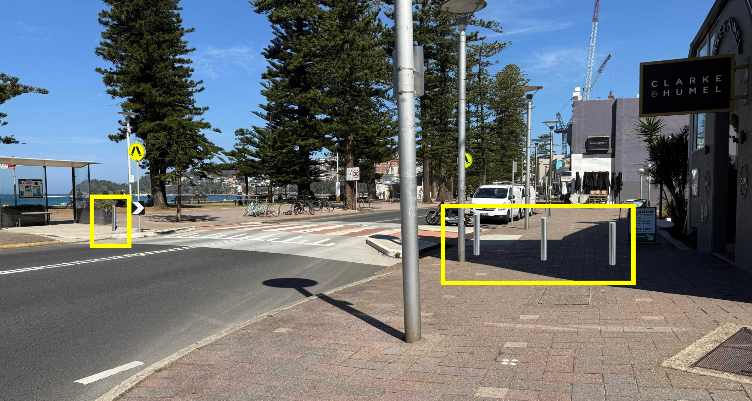 After: Road along beachfront with indicative bollards installed on footpath