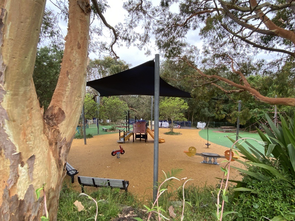 play equipment under shade sail