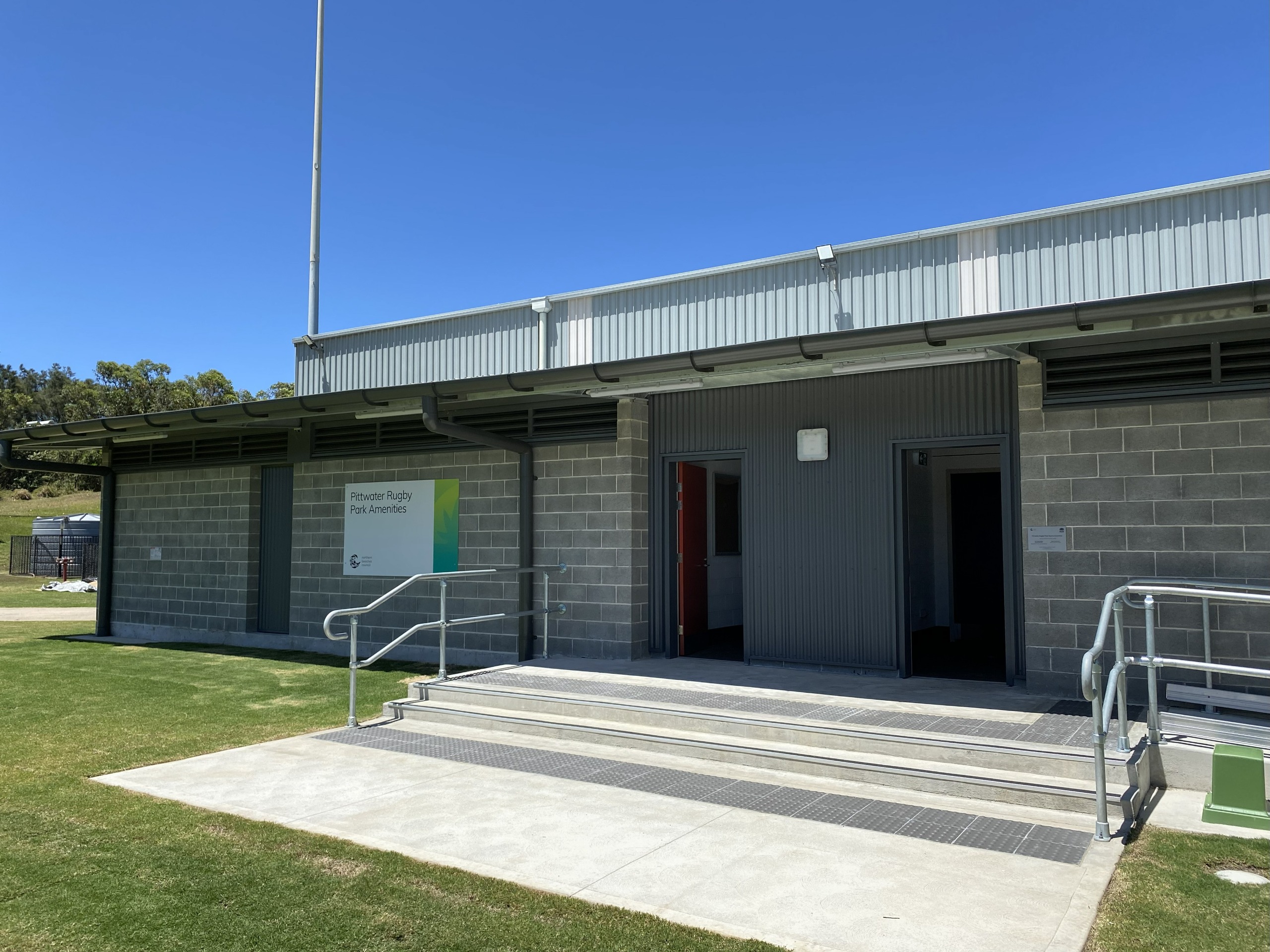 new toilet building with concrete stairs and railings