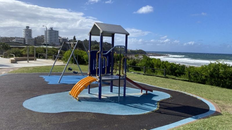 playground equipment with yellow slide