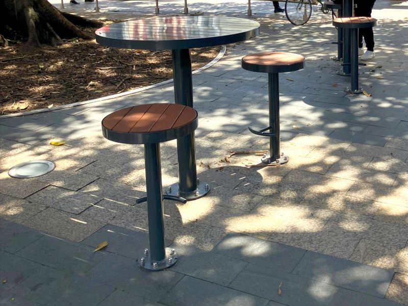 table with stool seating near tree